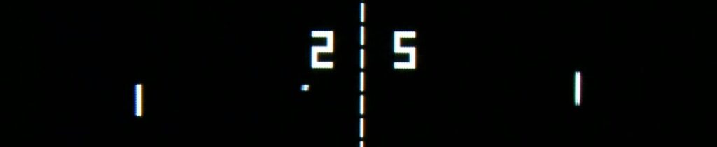 Screen capture of Atari's Pong video game with white digital paddles, ball, net and score on a black background. 